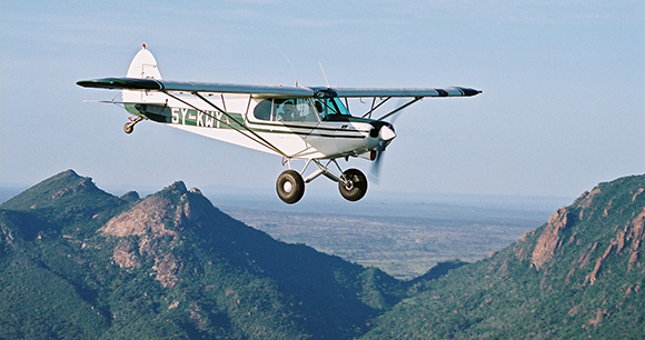 Kenya Wildlife Services Plane flying over Ngulia Hills