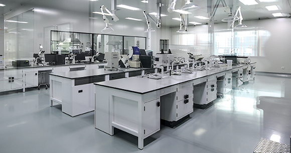 Empty science laboratory with desks and equipment.
