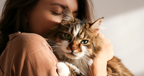 woman holding cat