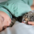 child snuggling with cat - photo by Steve
