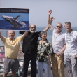 NGOs who participated in the 1982 meeting when the decision was taken celebrate on the seafront.